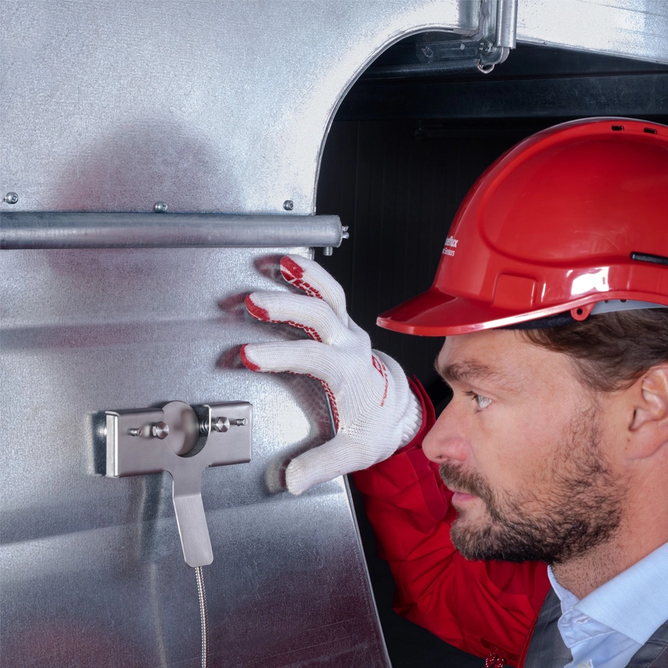 A man attaching a IHF02 Industrial Heat Flux Sensor to steel.