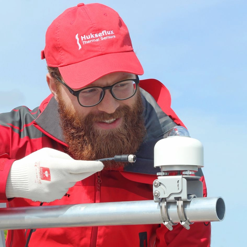 A man working with a PMF01 Mounting Fixture.